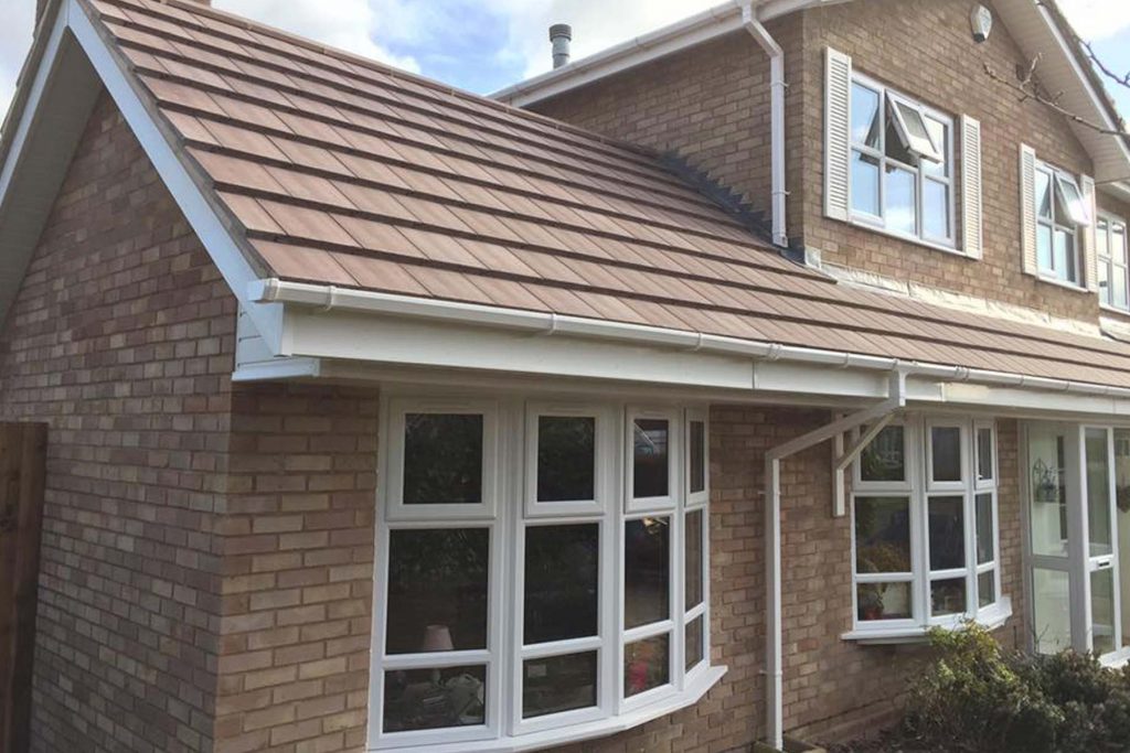 Single storey house extension Kenilworth Warwickshire in brick with tiled roof.